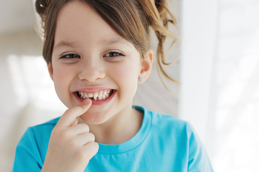 What to Know About Your Child’s First Loose Tooth